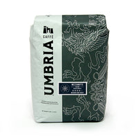 white and grey coffee bag with silver design and blue mezzanotte decaf sticker