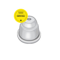 image of white compostable nespresso compatible capsule with white band, and compostable sticker overlay
