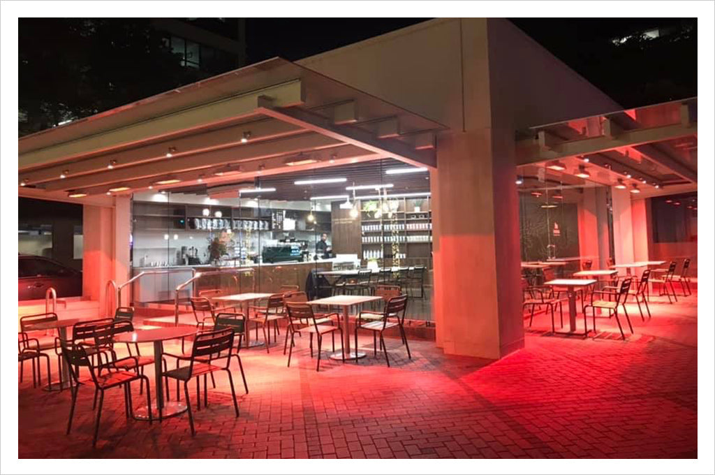 outside view of cafe and patio heated with red lights