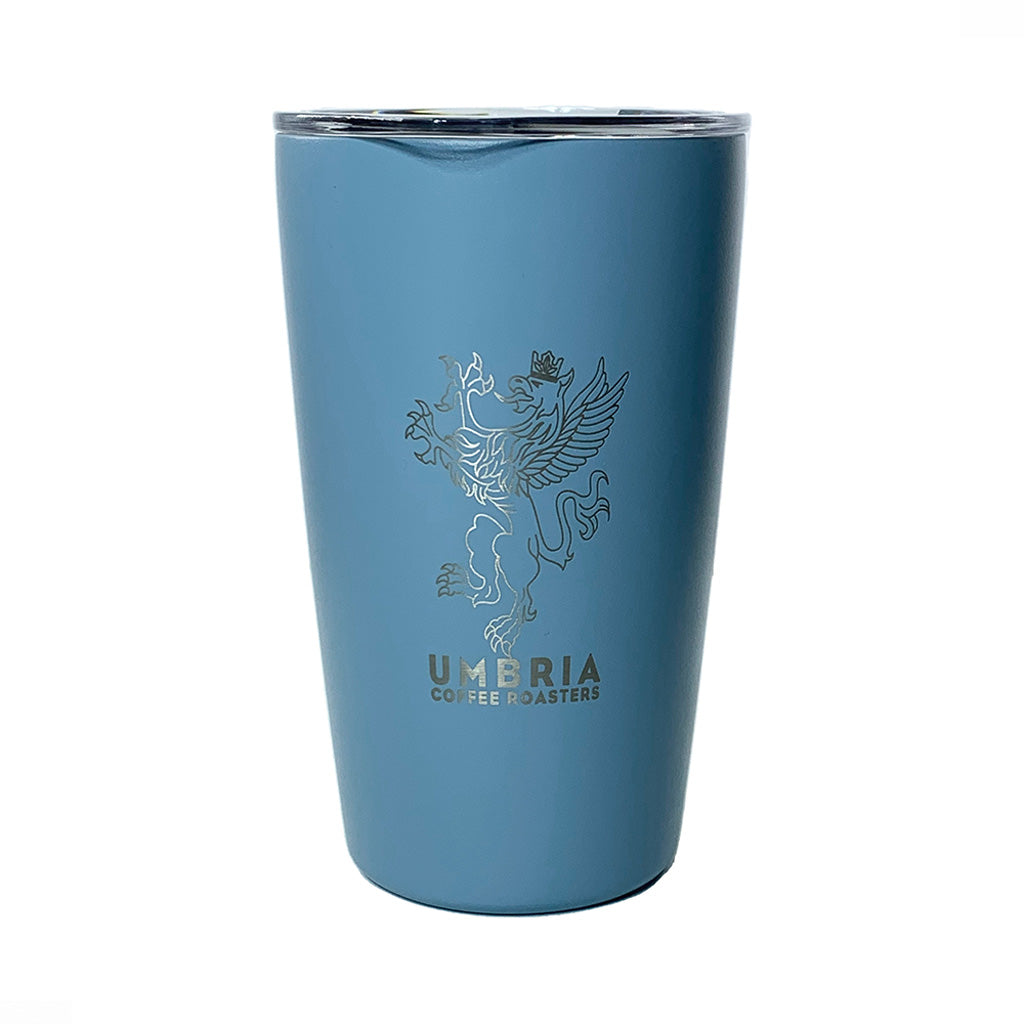 Blue tumbler with Umbria Coffee Roasters logo on a white background