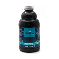 plastic bottle of coffee concentrate with blue and turquoise label