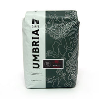 white and grey coffee bag with silver design and black and red grifo medium roast label