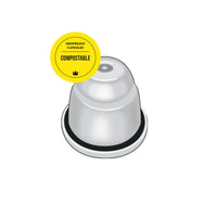 white compostable capsule with black band, compostable sticker overlay