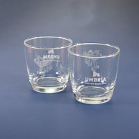 two glasses with white logo on blue background